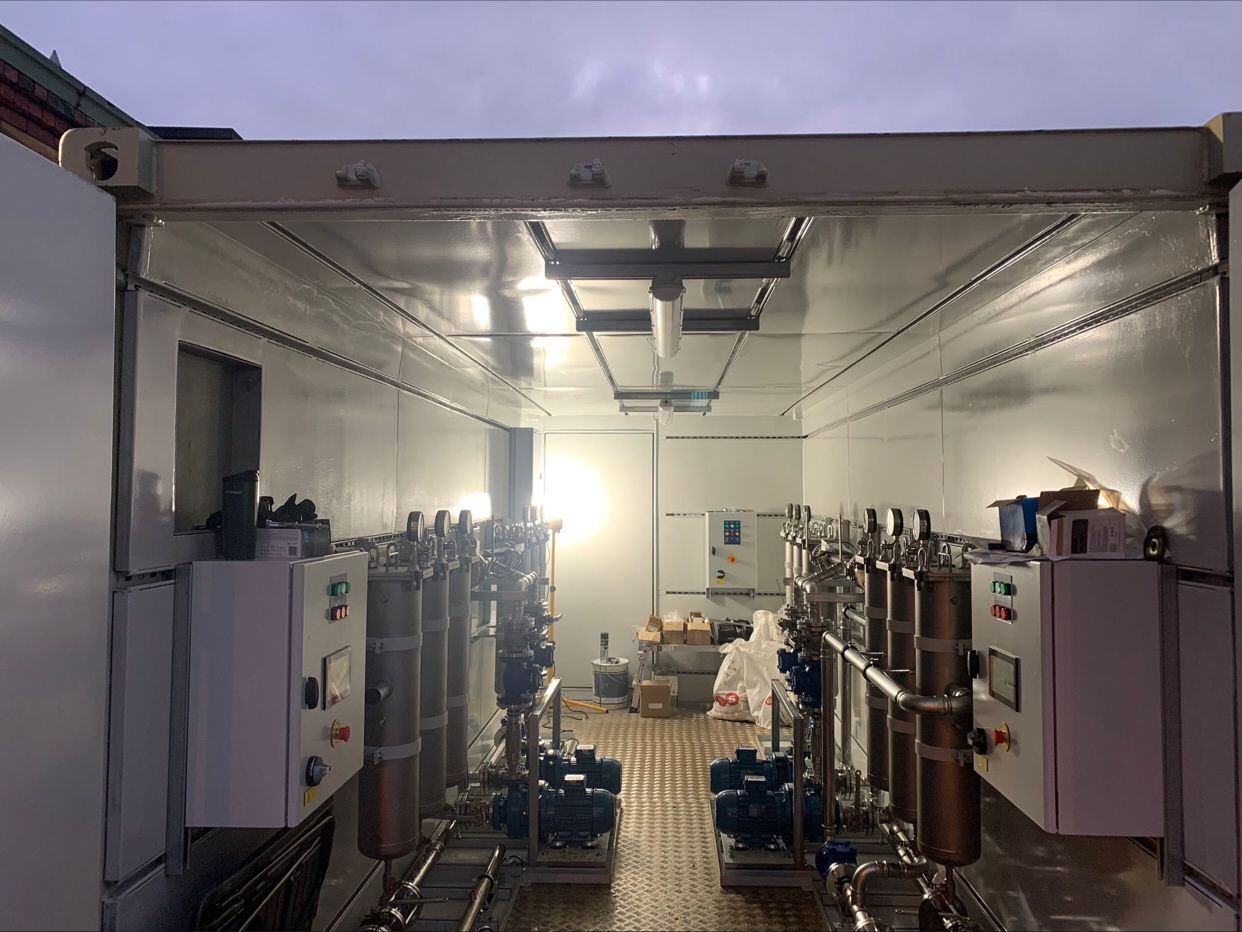 A container load of identical control panels leaving the factory