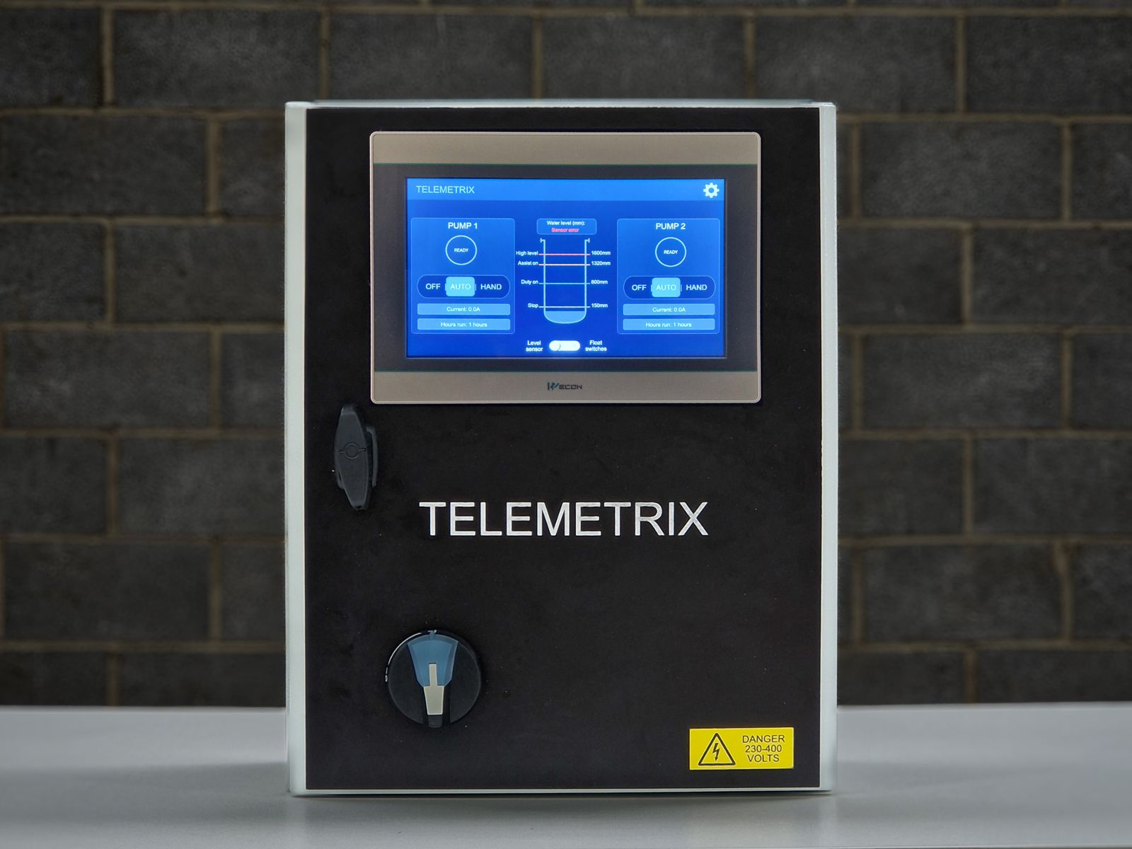 Telemetrix View pump control panel with touchscreen mounted on a brick wall